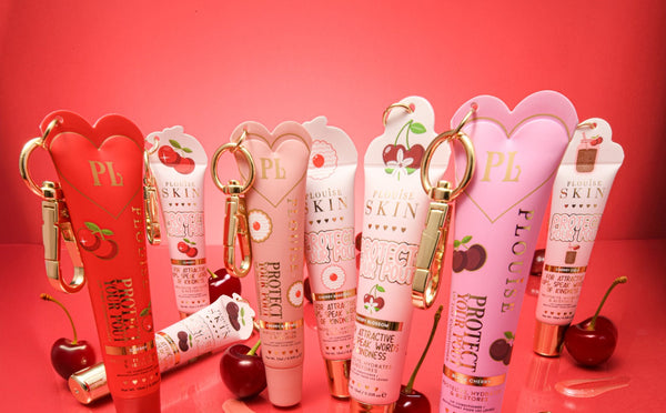 Image of red and pink P.Louise Protect Your Pout Lip Conditioners on a red background