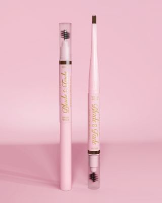 An image of two P.Louise Blade & Fade Eyebrow Pencils With Brush, one with the lid on and the other with the lid off showing the blade against a pink background