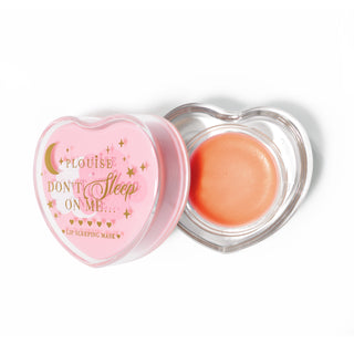 Pink heart-shaped lip sleeping mask with the lid off on a white background