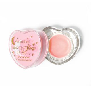 Pink heart-shaped lip sleeping mask with the lid off on a white background