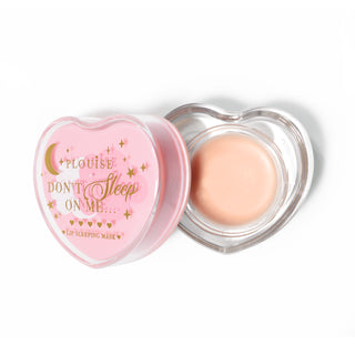 Pink heart-shaped lip sleeping mask with the lid off on a white background