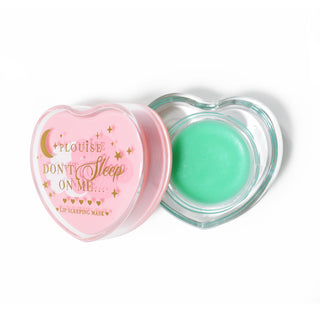 Pink heart-shaped lip sleeping mask with the lid off on a white background
