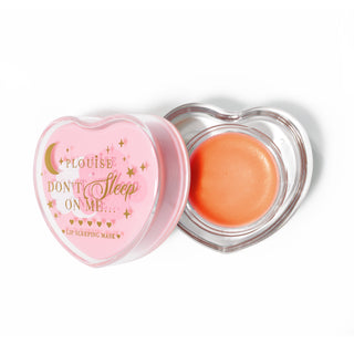 Pink heart-shaped lip sleeping mask with the lid off on a white background