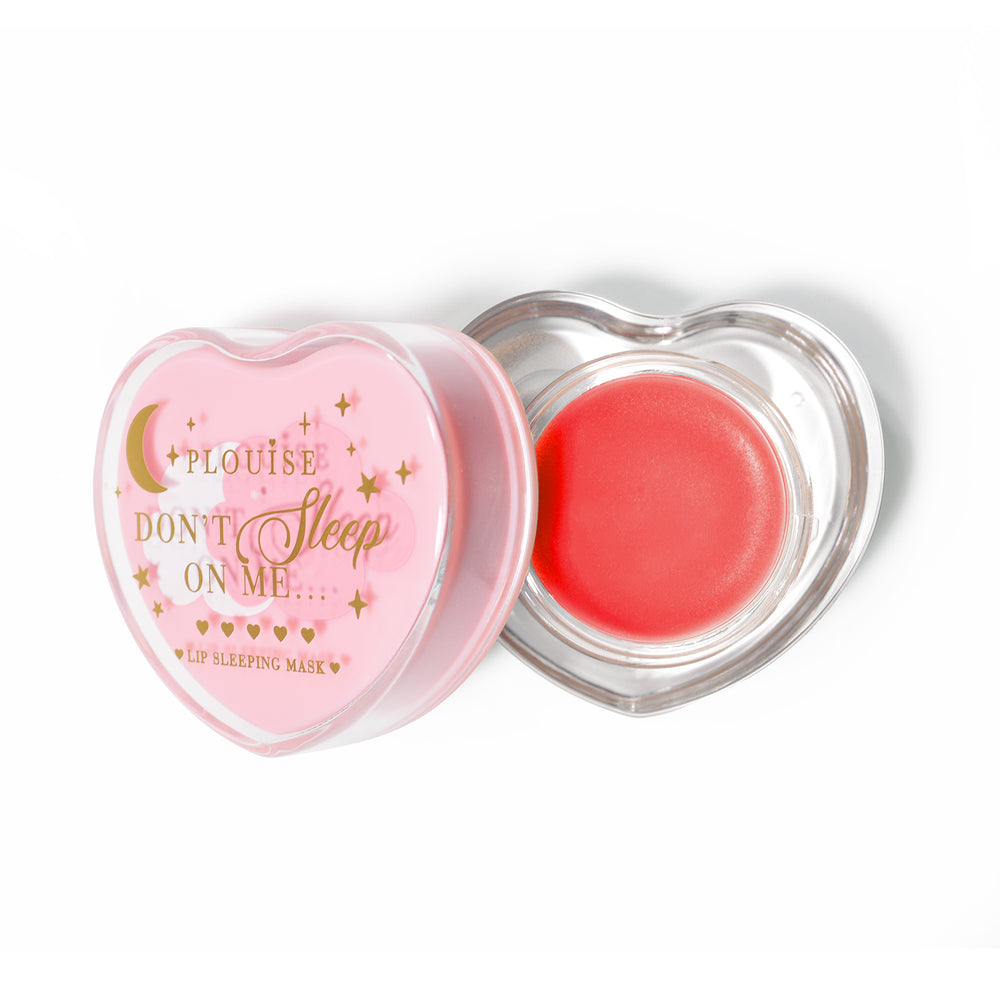 Pink heart-shaped lip sleeping mask with the lid off on a white background