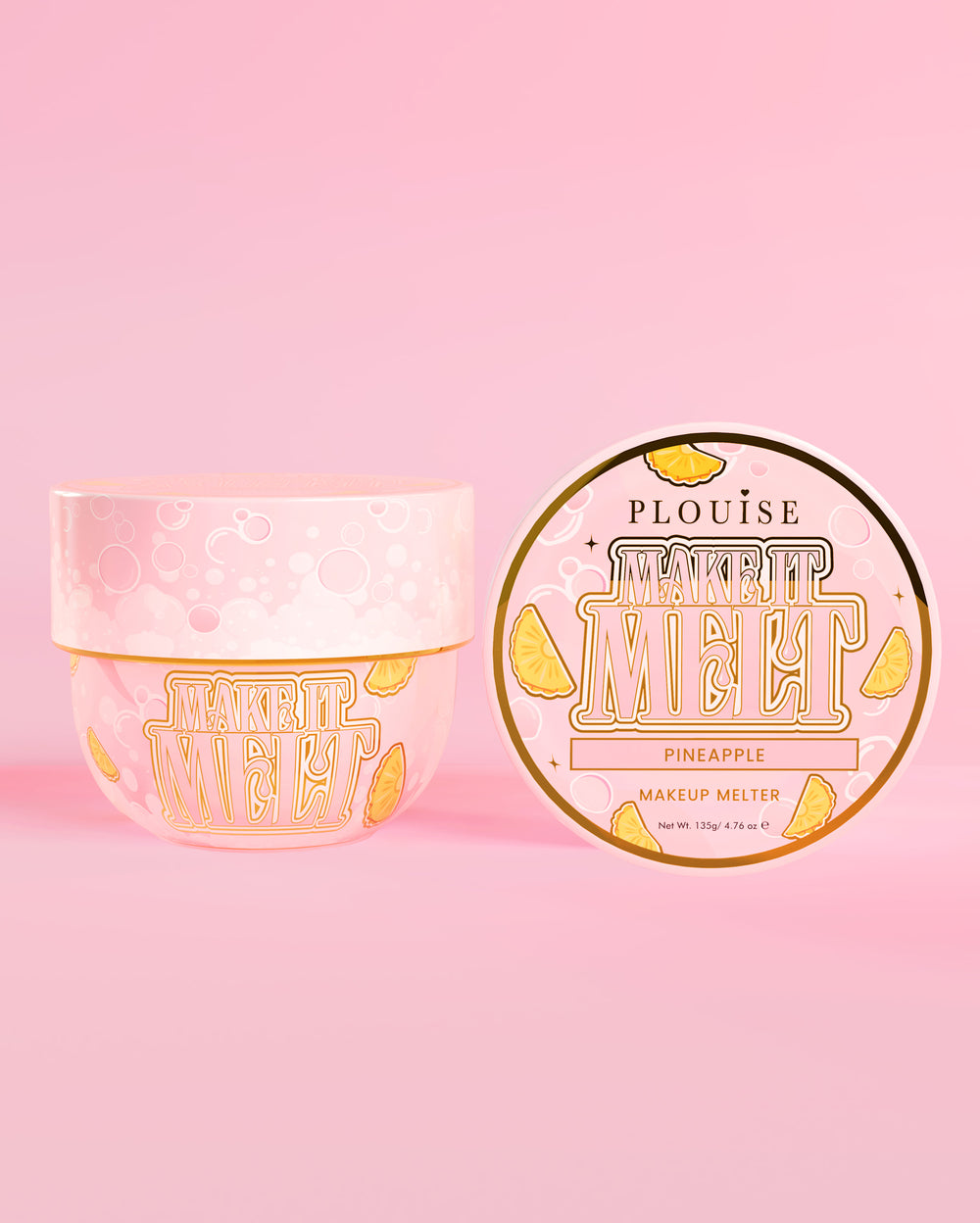 Tub of P. Louise Make It Melt Makeup Cleansing Balm with pineapple flavour on a pink background