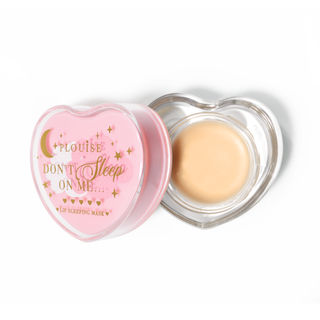 Pink heart-shaped lip sleeping mask with the lid off on a white background