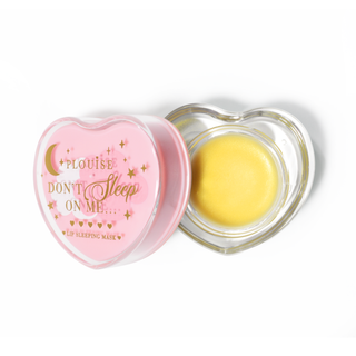 Pink heart-shaped lip sleeping mask with the lid off on a white background