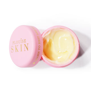 A pink open jar of P.Louise Give It A Rest Eye Cream showing the yellow tinted moisturiser inside